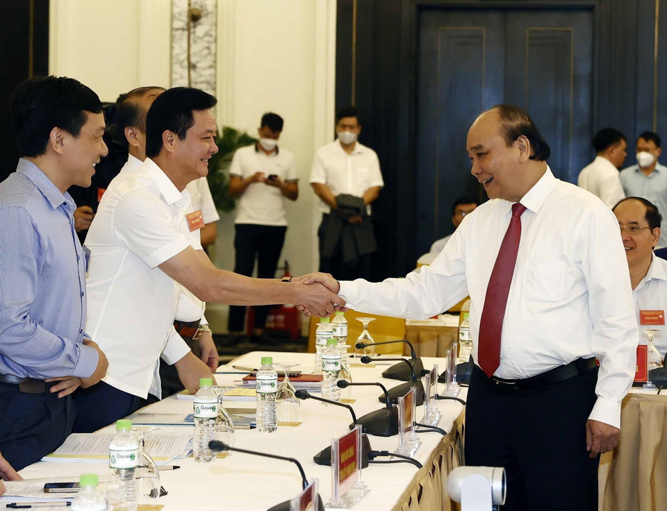 Chủ tịch nước Nguyễn Xuân Phúc và các đại biểu dự hội nghị. (Ảnh: Thống Nhất/TTXVN)