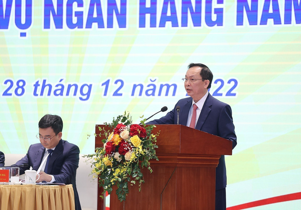 Phó Thống đốc Ngân hàng Nhà nước Đào Minh Tú báo cáo kết quả hoạt động ngân hàng năm 2022, định hướng điều hành năm 2023. (Ảnh: Dương Giang/TTXVN)