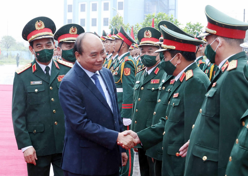 Chủ tịch nước Nguyễn Xuân Phúc với các đại biểu tham dự buổi lễ. (Ảnh: Thống Nhất/TTXVN)