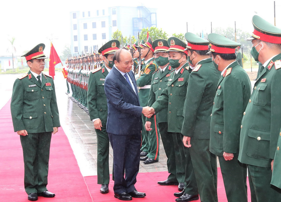 Chủ tịch nước Nguyễn Xuân Phúc, Chủ tịch Hội đồng Quốc phòng và An ninh, Thống lĩnh các lực lượng vũ trang dự buổi lễ. (Ảnh: Trọng Đức/TTXVN)