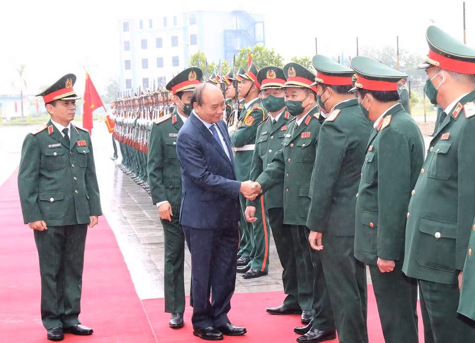 Chủ tịch nước Nguyễn Xuân Phúc, Chủ tịch Hội đồng Quốc phòng và An ninh, Thống lĩnh các lực lượng vũ trang dự buổi lễ. (Ảnh: Trọng Đức/TTXVN)