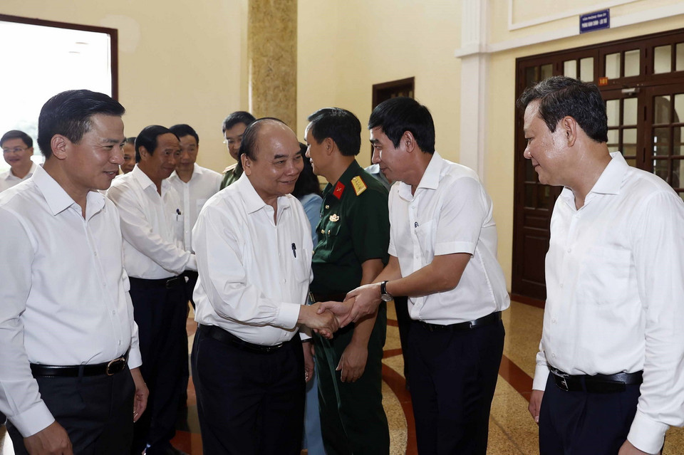 Chủ tịch nước Nguyễn Xuân Phúc với các đại biểu dự buổi làm việc. (Ảnh: Thống Nhất/TTXVN)