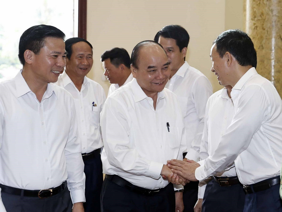 Chủ tịch nước Nguyễn Xuân Phúc cùng các đại biểu dự buổi làm việc. (Ảnh: Thống Nhất/TTXVN)