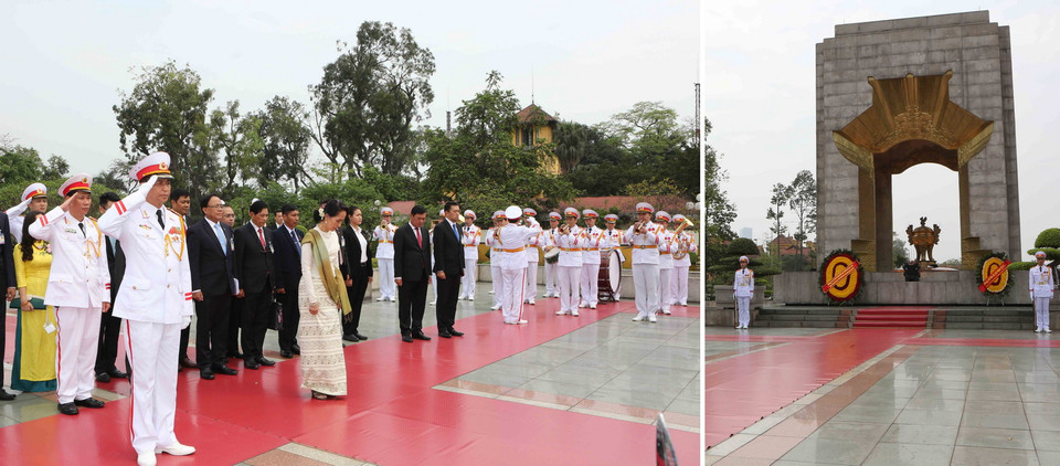 Cố vấn Nhà nước, Bộ trưởng Ngoại giao, Bộ trưởng Văn phòng Tổng thống Cộng hòa Liên bang Myanmar, bà Aung San Suu Kyi đến đặt vòng hoa tại Đài tưởng niệm các Anh hùng Liệt sỹ. (Ảnh: Dương Giang/TTXVN)