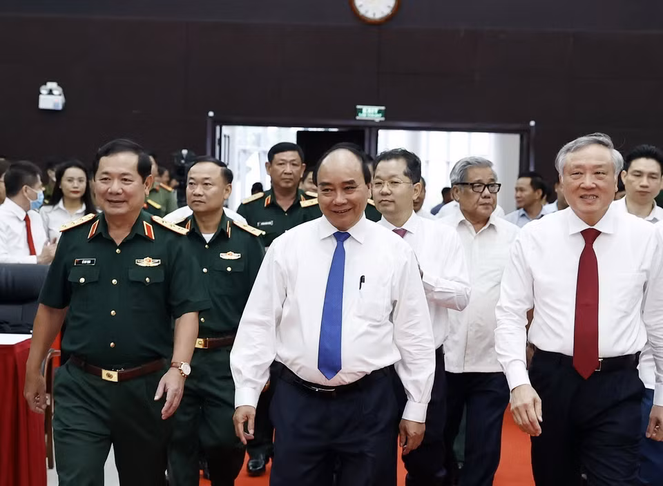 Chủ tịch nước Nguyễn Xuân Phúc và các đại biểu đến dự Hội thảo. (Ảnh: Thống Nhất/TTXVN)