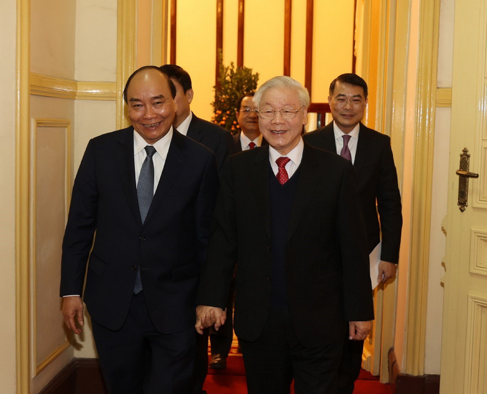 Tổng Bí thư, Chủ tịch nước Nguyễn Phú Trọng và Thủ tướng Nguyễn Xuân Phúc đến dự buổi chúc Tết. (Ảnh: Trí Dũng/TTXVN)