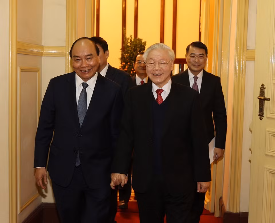 Tổng Bí thư, Chủ tịch nước Nguyễn Phú Trọng và Thủ tướng Nguyễn Xuân Phúc đến dự buổi chúc Tết. (Ảnh: Trí Dũng/TTXVN)