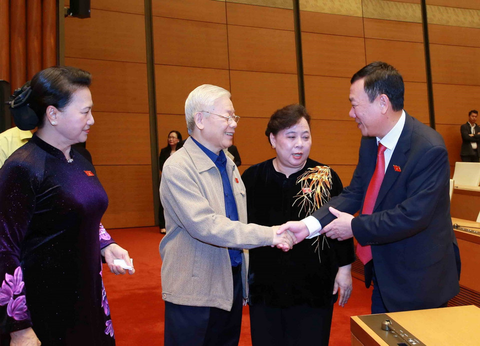 Tổng Bí thư, Chủ tịch nước Nguyễn Phú Trọng, Chủ tịch Quốc hội Nguyễn Thị Kim Ngân với các đại biểu Quốc hội. (Ảnh: Phương Hoa/TTXVN)