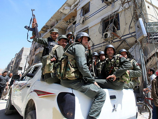 Lực lượng an ninh Syria ở Damascus. (Nguồn: Reuters) Syria: Phiến quân sẽ rời khỏi địa bàn gần thủ đô Damascus ảnh 1