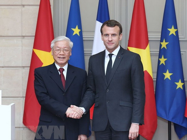 Tổng Bí thư Nguyễn Phú Trọng và Tổng thống Cộng hòa Pháp Emmanuel Macron. (Ảnh: Trí Dũng/TTXVN) Quan hệ Việt Nam-Pháp dưới góc nhìn lịch sử, ngoại giao và kinh tế ảnh 1