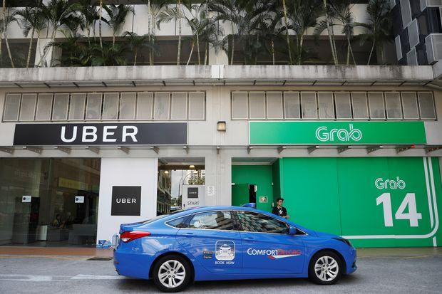 Singapore điều tra thỏa thuận chuyển nhượng giữa Uber và Grab ảnh 1