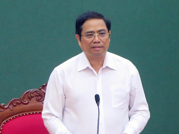 Trưởng ban Tổ chức Trung ương tặng quà các gia đình chính sách ảnh 1