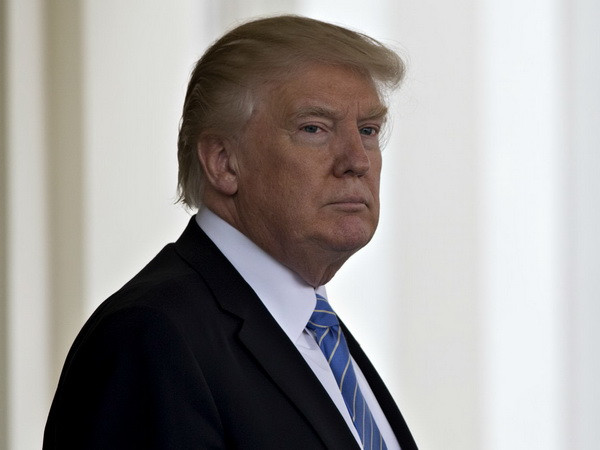 Tổ chức Ân xá quốc tế cáo buộc ông Trump hạ thấp nhân quyền ảnh 1