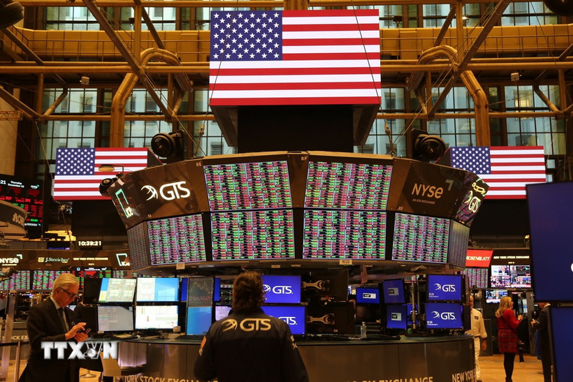 Giao dịch viên tại Sàn chứng khoán New York (Mỹ). (Ảnh: THX/TTXVN)