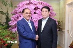 Chủ tịch nước Lương Cường thăm, chúc Tết nguyên Tổng Bí thư Nông Đức Mạnh. (Ảnh: Lâm Khánh/TTXVN)