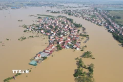 Lũ sông Cầu xuống dưới báo động 3, nhưng vẫn gây ngập các khu vực ven sông. (Ảnh: Vũ Quang/TTXVN)