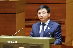 Bộ trưởng Bộ Tài chính Nguyễn Văn Thắng trình bày Tờ trình về dự án Luật Dự trữ quốc gia (sửa đổi). (Ảnh: Doãn Tấn/TTXVN)