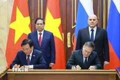 Thủ tướng Phạm Minh Chính và Thủ tướng Liên bang Nga Mikhail Mishustin chứng kiến Lễ ký kết Hiệp định về hợp tác xây dựng Nhà máy điện hạt nhân trên lãnh thổ Việt Nam. (Ảnh: Dương Giang/TTXVN)