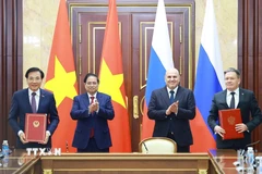 Thủ tướng Phạm Minh Chính và Thủ tướng Liên bang Nga Mikhail Mishustin chứng kiến Lễ ký kết Hiệp định về hợp tác xây dựng Nhà máy điện hạt nhân trên lãnh thổ Việt Nam. (Ảnh: Dương Giang/TTXVN)