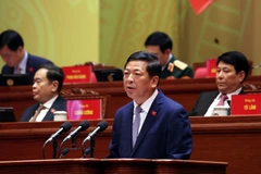 Đồng chí Trần Hồng Minh, Ủy viên Trung ương Đảng, Bí thư Đảng ủy, Bộ trưởng Bộ Xây dựng, tham luận về vấn đề “Đột phá mạnh mẽ phát triển kết cấu hạ tầng trong kỷ nguyên mới”. (Ảnh: TTXVN)