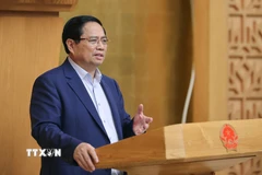 Thủ tướng Phạm Minh Chính chủ trì cuộc họp Chính phủ về tháo gỡ khó khăn, vướng mắc trong thực hiện chính quyền địa phương hai cấp. (Ảnh: Dương Giang/TTXVN)