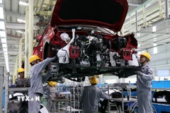 Lắp ráp ôtô tại Tập đoàn THACO. (Ảnh: Trần Tĩnh/TTXVN)
