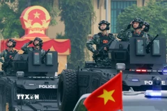 Khối xe đặc chủng của lực lượng Công an tham gia diễu hành tại buổi lễ. (Ảnh: Phạm Kiên/TTXVN)