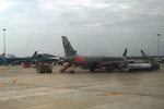 Máy bay của hai hãng hàng không Vietnam Airlines và Jetstar Pacific. (Ảnh: Việt Hùng/Vietnam+)