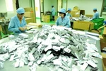 Đóng gói thuốc thành phẩm tại một công ty dược. (Ảnh: TTXVN/Vietnam+)