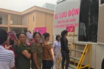Xe lưu động khám sàng lọc phát hiện ung thư cho phụ nữ. (Ảnh:PV/Vietnam+)