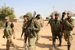 Các lực lượng ủng hộ Thổ Nhĩ Kỳ ở ngoại ô thị trấn biên giới Ras al-Ain, Syria ngày 16/10/2019. (Ảnh: AFP/TTXVN)