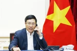 Phó Thủ tướng, Bộ trưởng Ngoại giao Phạm Bình Minh điện đàm với Bộ trưởng Ngoại giao Malaysia. (Ảnh: Lâm Khánh/TTXVN)