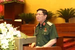 Bộ trưởng Bộ Quốc phòng Ngô Xuân Lịch giải trình ý kiến của đại biểu Quốc hội. (Ảnh: Doãn Tấn/TTXVN)