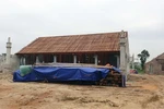 Dù chỉ mới xây dựng 2 tháng song có 6 tòa nhà và cổng Tam quan đã được xây dựng xong phần thô. (Ảnh: Tá Chuyên/TTXVN)