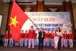 Bộ Trưởng Bộ Văn hóa-Thể thao và Du lịch Nguyễn Ngọc Thiện và các vận động viên tại lễ xuất quân. (Ảnh: Quốc Khánh/TTXVN)