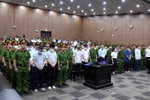 Thẩm phán, Chủ tọa phiên tòa Vũ Quang Huy tuyên án sơ thẩm đối với 54 bị cáo trong vụ án "Chuyến bay giải cứu." (Ảnh: Phạm Kiên/TTXVN)