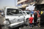 Hiện trường vụ đánh bom xe ở Sadr City, Baghdad, Iraq ngày 11/5. (Nguồn: AFP/TTXVN)