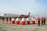Đội ngũ tiếp viên hàng không Vietjet Air. (Ảnh: CTV/Vietnam+)