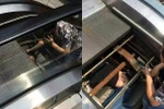 Người đàn ông bị cuốn vào trong thang máy, chỉ còn đầu hở ra ngoài.