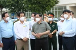 Thủ tướng Phạm Minh Chính cùng lãnh đạo Bộ, ngành Trung ương kiểm tra phòng chống dịch COVID-19 tại TP. Hồ Chí Minh. (Ảnh: Xuân Tình/TTXVN)