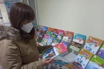 Sách giáo khoa lớp 10 mới sẽ được đưa vào giảng dạy trong các nhà trường từ năm học 2022-2023. (Ảnh: Phạm Mai/Vietnam+)