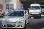 Xe cảnh sát và xe cứu thương mang thi thể ông Kim Jong-nam rời bệnh viện ở Putrajaya, Malaysia ngày 15/2. (Nguồn: EPA/TTXVN)