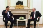 Tổng thống Nga Vladimir Putin (phải) trong cuộc gặp Chủ tịch Trung Quốc Tập Cận Bình tại thủ đô Moskva, ngày 20/3/2023. (Ảnh: AFP/TTXVN)