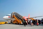 Hành khách đi lại trên chuyến bay của Vietjet. (Ảnh: Vietjet cung cấp)