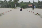 Ngập lụt tại xã Lộc Trì, huyện Phú Lộc, Thừa Thiên-Huế. (Ảnh: Hồ Cầu/TTXVN)
