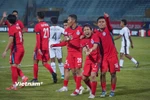 Chiến thắng 3-0 trước Timor Leste giúp Đội tuyển Singapore (áo đỏ) "rộng cửa" đi tiếp tại bảng A - AFF Cup 2024. (Ảnh: Việt Anh/Vietnam+)