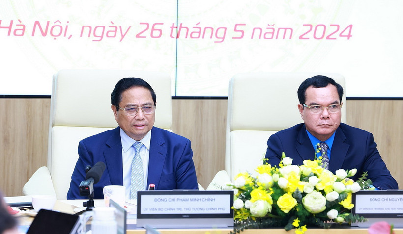 Thủ tướng Phạm Minh Chính phát biểu tại Hội nghị đánh giá việc thực hiện quy chế về mối quan hệ công tác giữa Chính phủ với Tổng Liên đoàn Lao động Việt Nam. (Ảnh: Dương Giang/TTXVN)