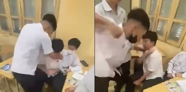 Nam sinh bị bạn đánh tới tấp ngay trong lớp học. (Ảnh cắt từ clip)