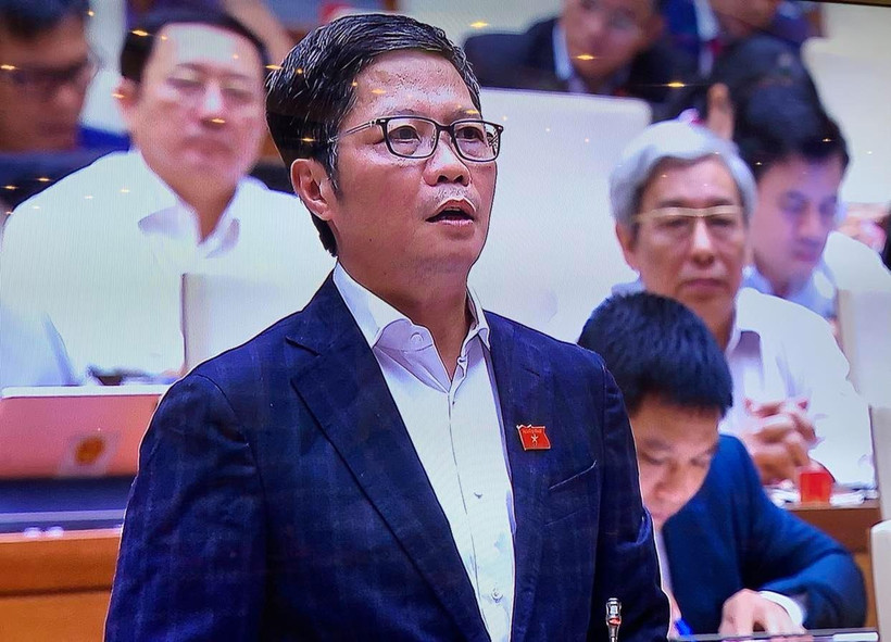 Bộ trưởng Trần Tuấn Anh trong buổi thảo luận ở Hội trường Quốc hội chiều nay, ngày 4/11. (Ảnh: Xuân Mai/Vietnam+)