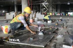 Lát đá sàn tầng 1 nhà ga hành khách sân bay Long Thành. (Ảnh: Công Phong/TTXVN)